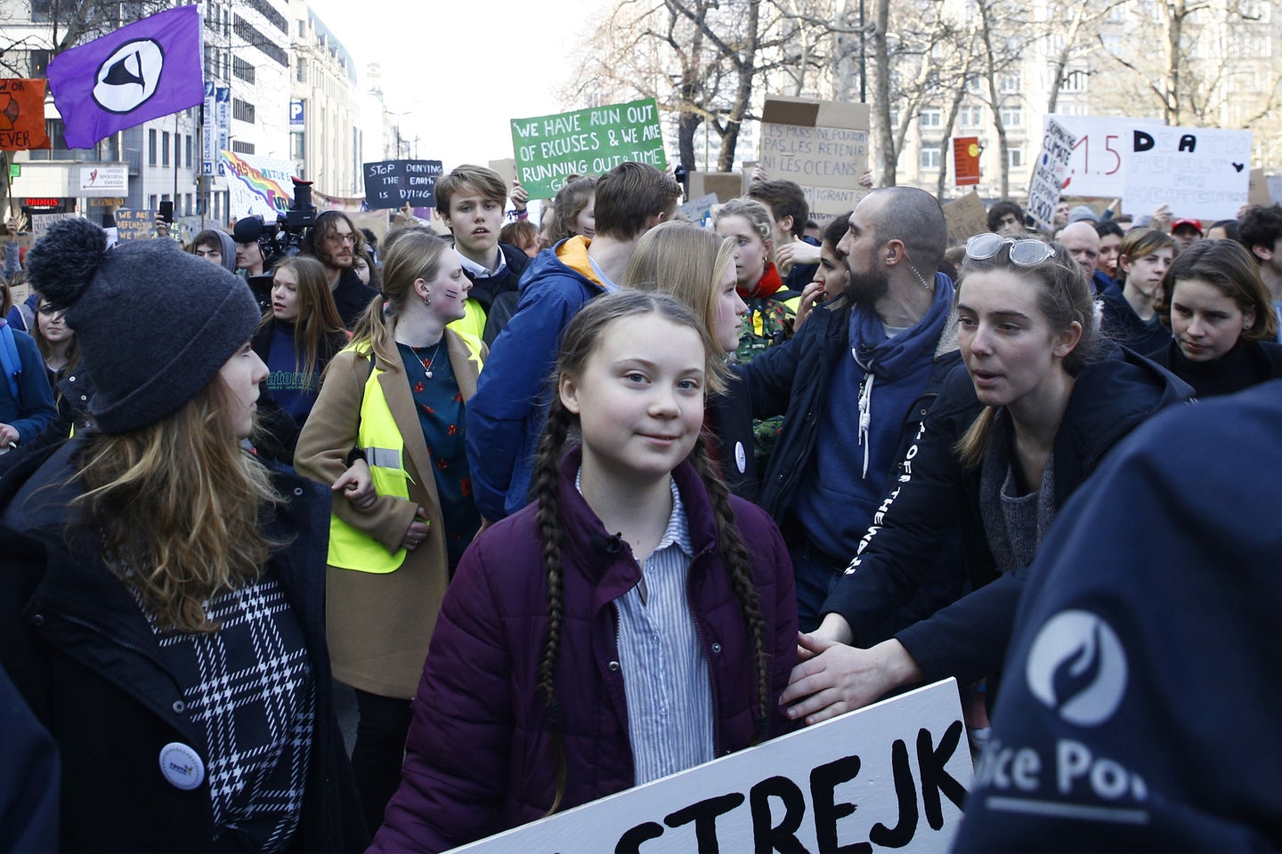Greta Thunberg in a crowd of activists at a protest