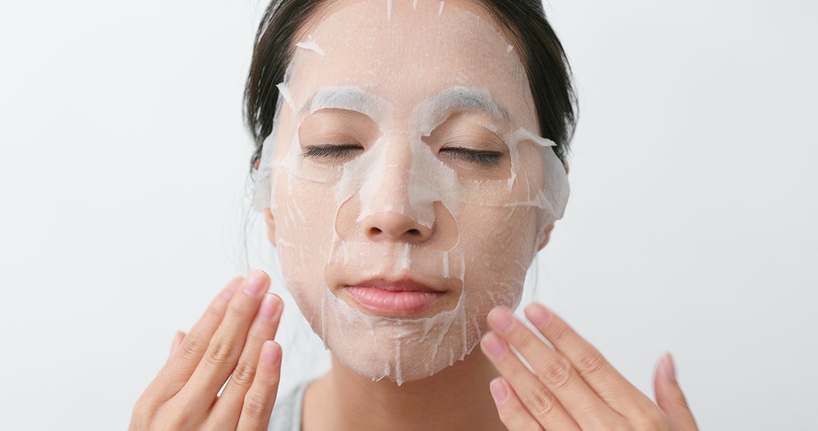 woman with a sheet mask on