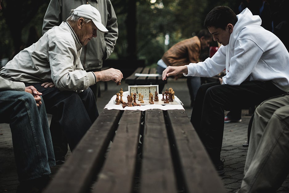 people playing chess in the park