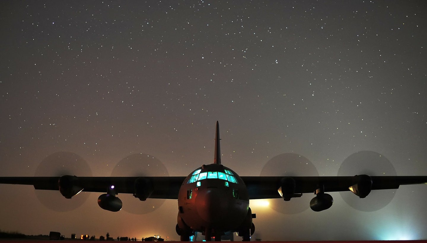 image of an airplane in front of a night sky