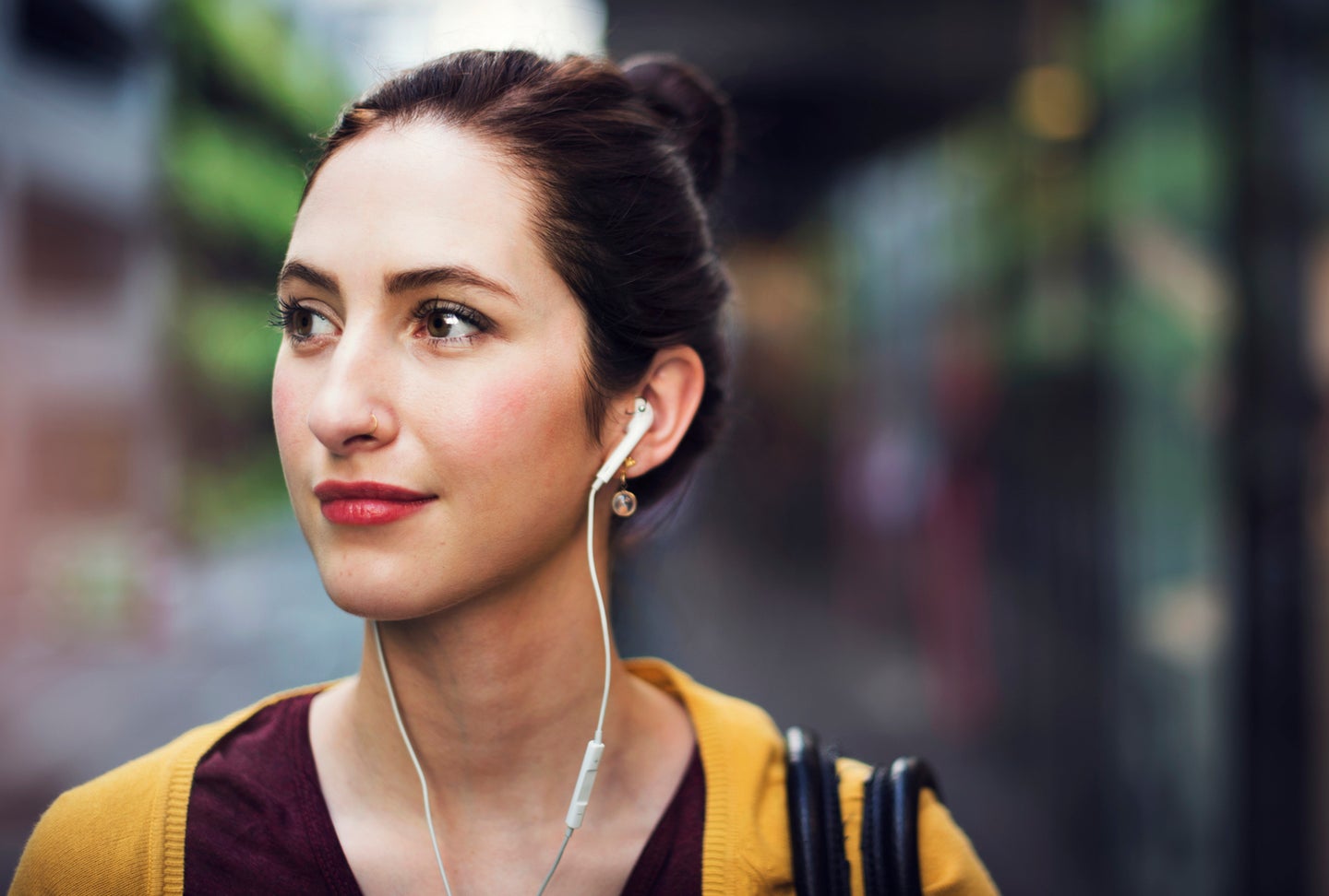 Woman outside wearing headphones