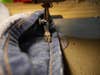 a sewing machine stitching jeans in the Hollywood Hem style