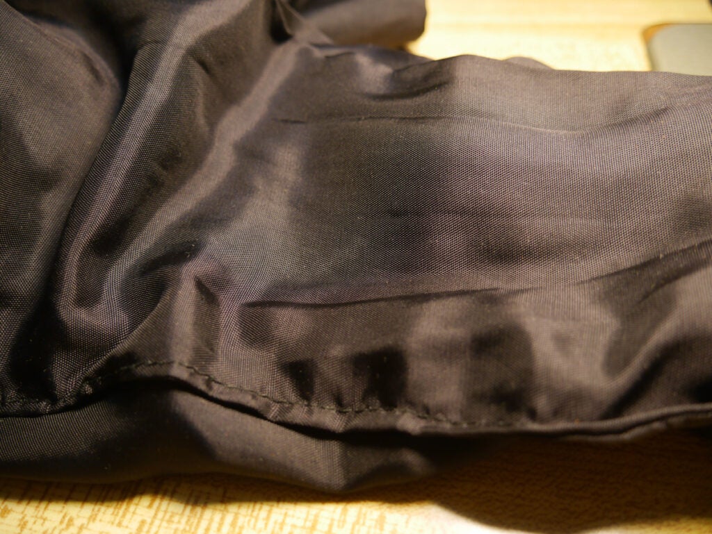 a women's coat with the top stitch visible