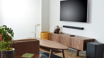 living room with a TV and soundbar