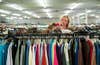 Person browsing in thrift store.