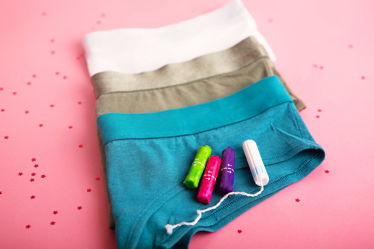 underwear and tampons on a pink background