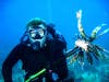 A diver with a speared lionfish.