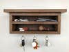 a small oak shelf key organizer cabinet hung with a French cleat so it appears to float on the wall