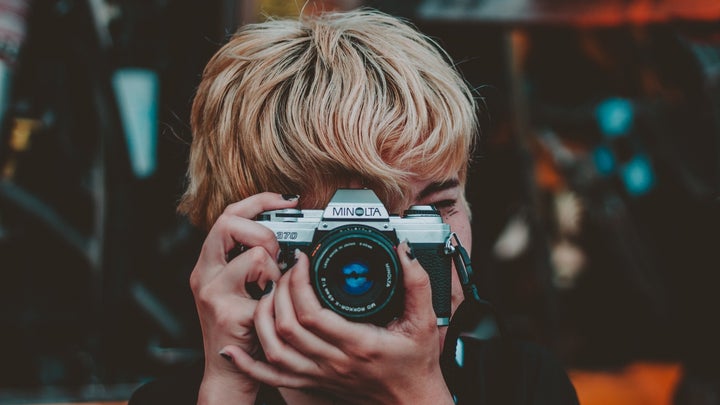 Person holding a film camera