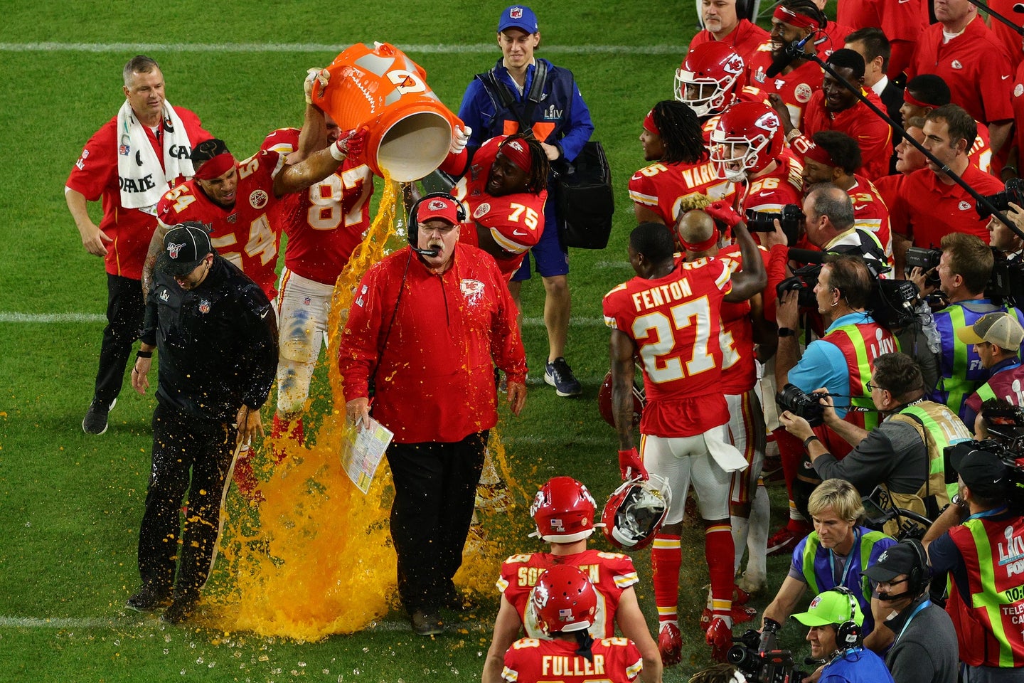 Kansas City Chiefs celebrating their Super Bowl LIV victory by pouring Gatorade on head coach Andy Reid