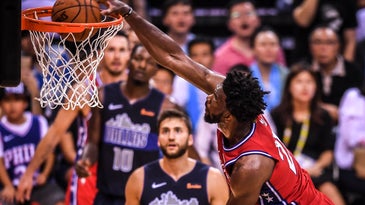 Joel Embiid of the Philadelphia 76ers pulls his 7-foot frame into a well-balanced dunk form.