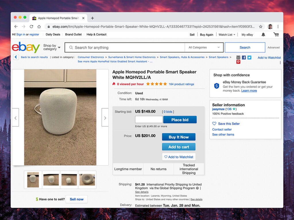 a screenshot of an eBay listing for an Apple Homepod with a photo of the Homepod on a gray carpet
