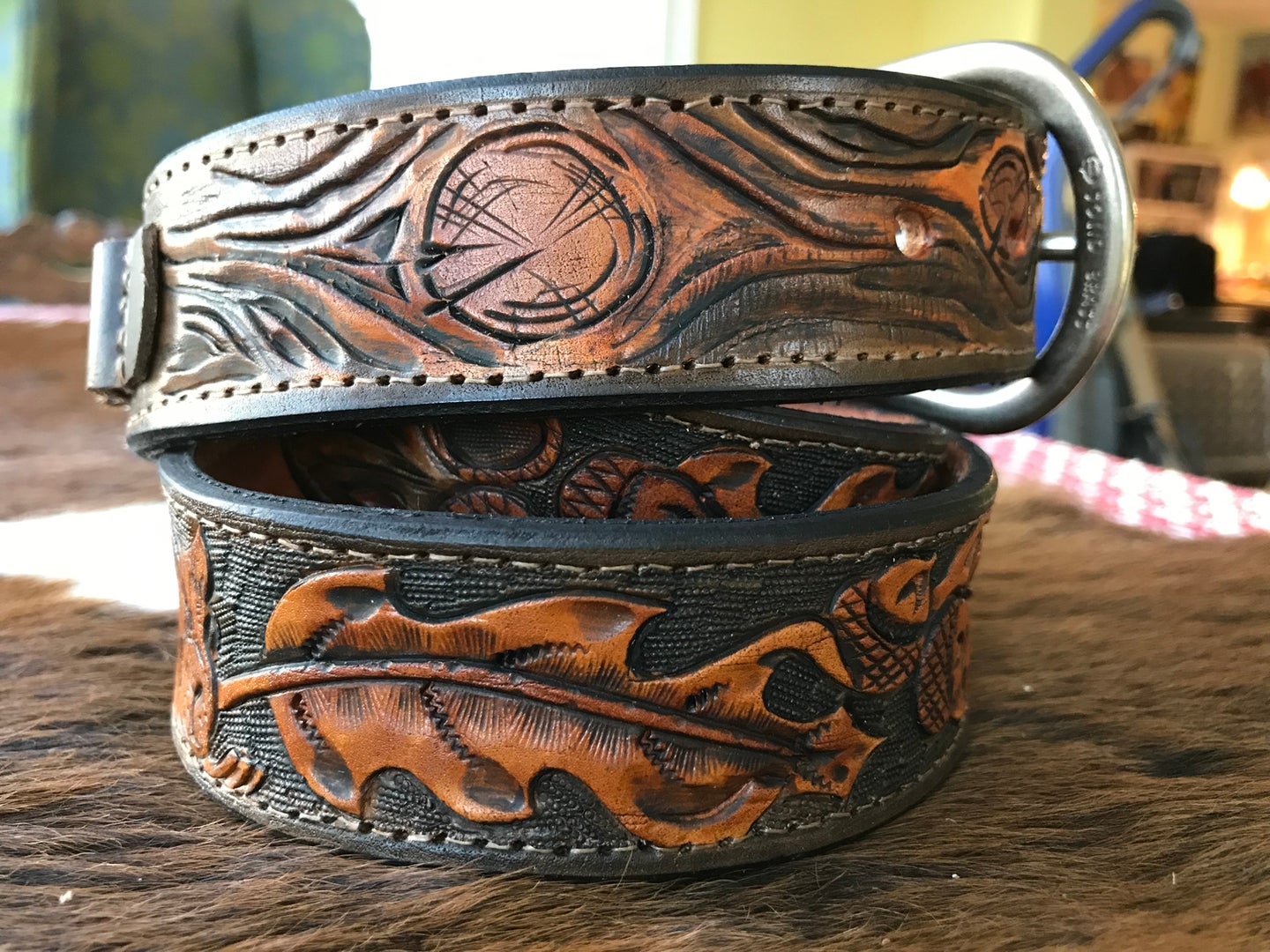 a photo of custom leatherwork on a coiled belt