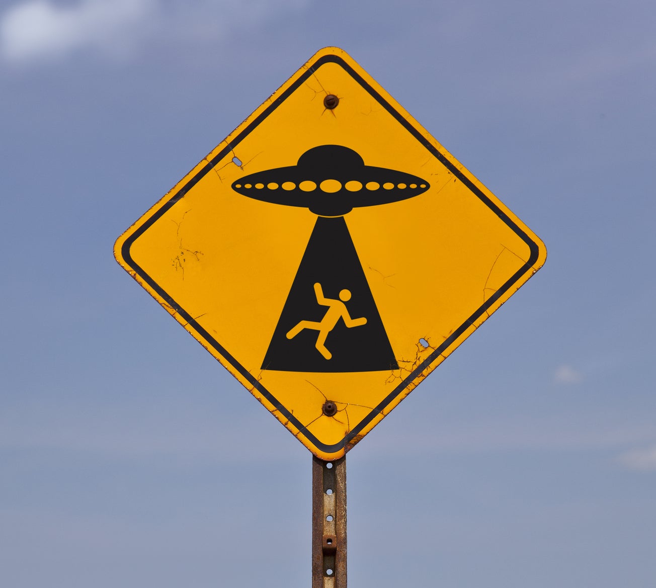 A road sign warning of possible alien abduction