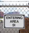 A fence sign for Area 51