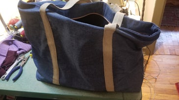 a DIY zippered tote bag made out of recycled fabric