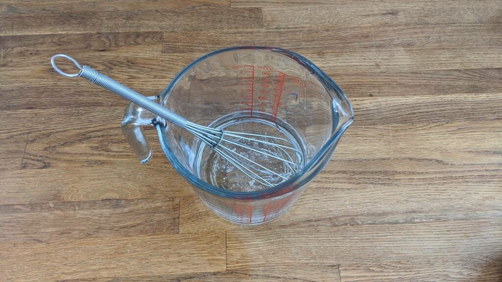 Whisk in measuring cup