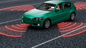 A mock self-driving car deploys its sensors on the road.