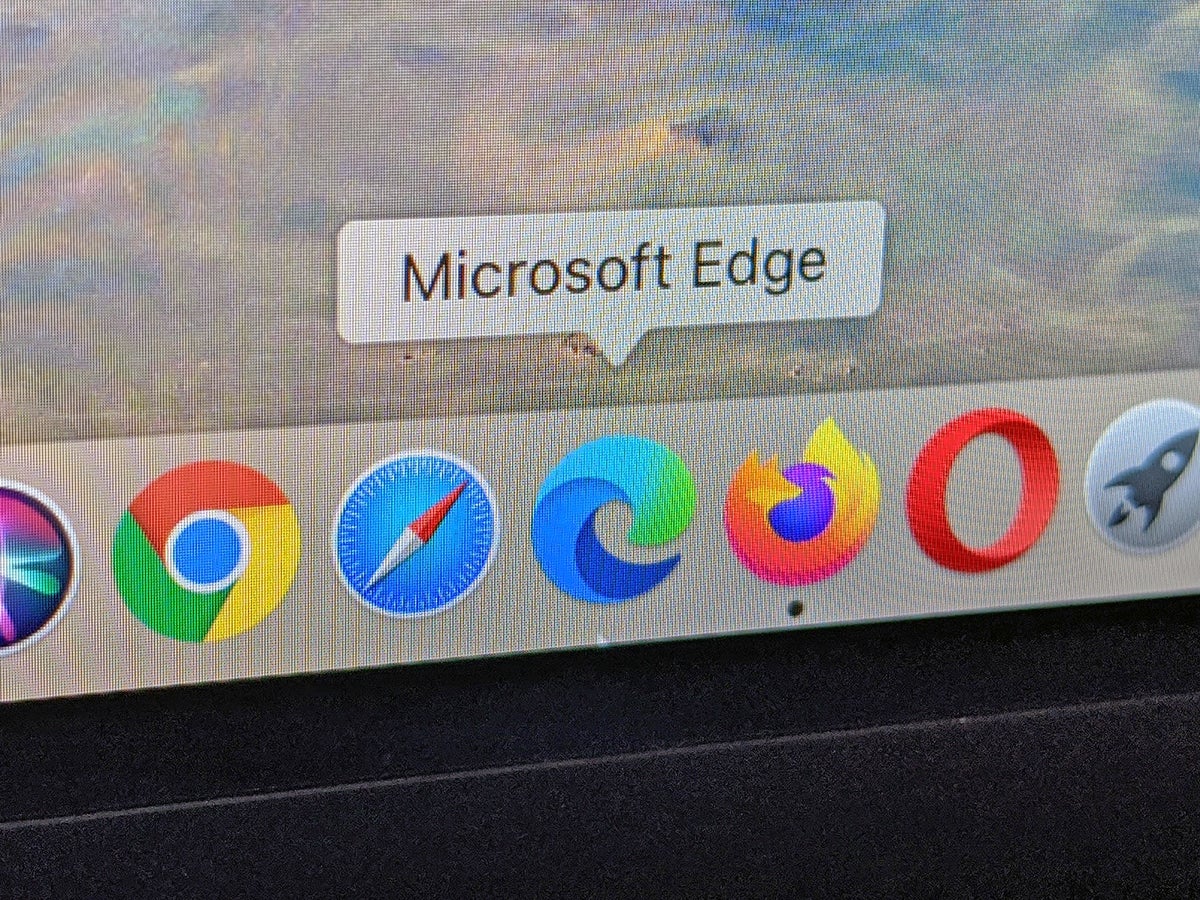 a photo of an Apple Mac laptop screen with the web browsers Google Chrome, Safari, Microsoft Edge, Mozilla Firefox, and Opera all in the task bar