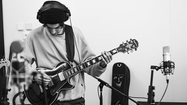 guitarist with headphones