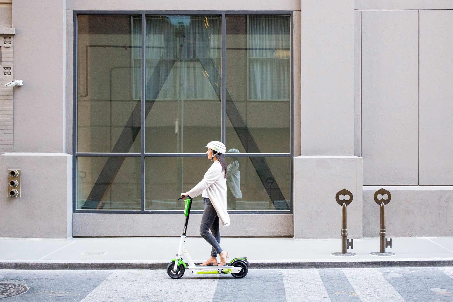 Woman riding a Lime scooter