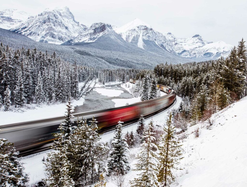 Lori Kupsch - A train zooms through the popular Morant's Curve in Banff National Park