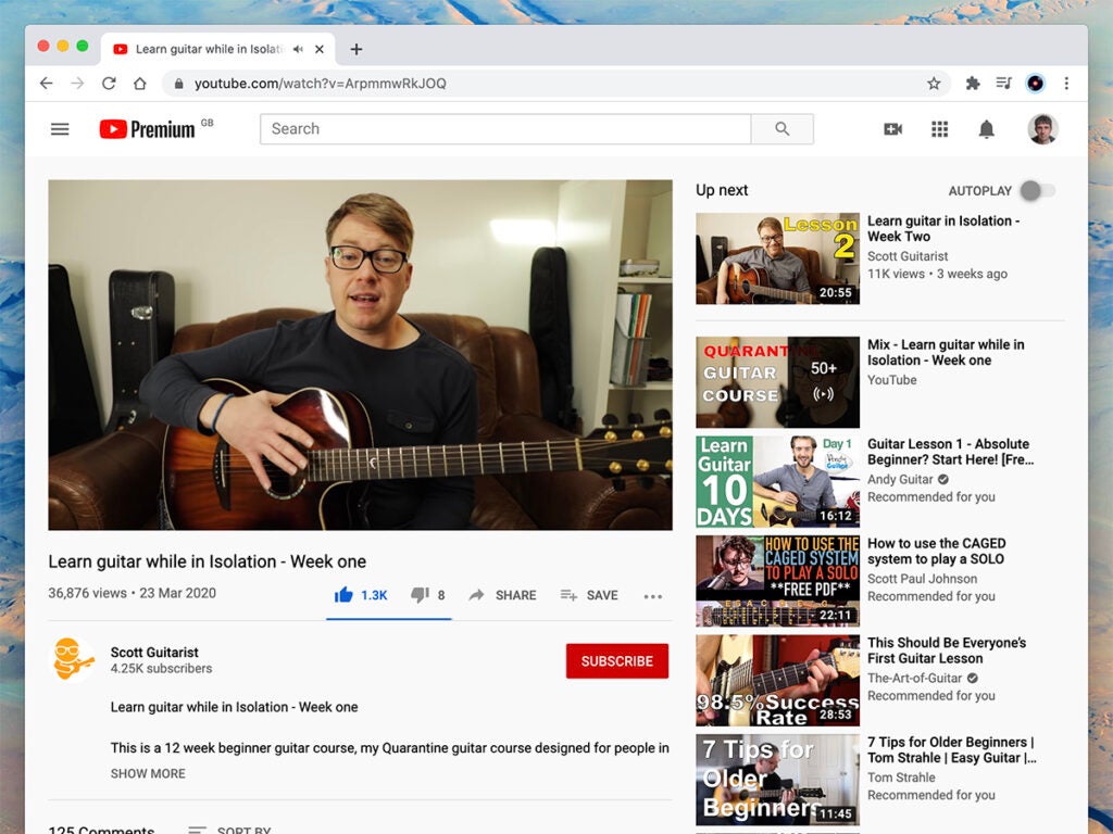 a person teaching guitar on YouTube