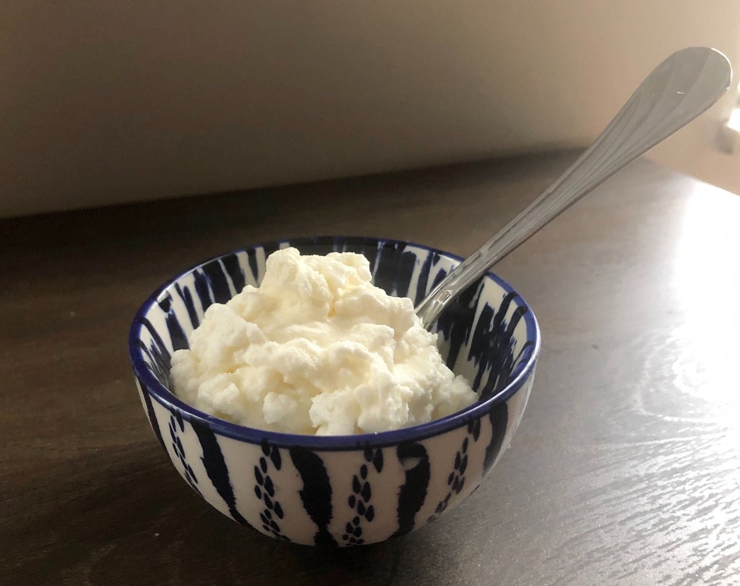 a bowl of vanilla ice cream made by shaking ingredients in a bag full of ice and salt
