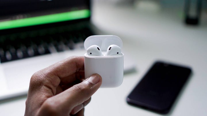 Hand holding Air Pods