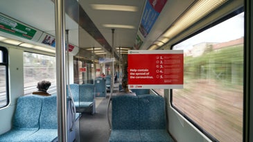 train with sign saying help contain the spread of the coronavirus