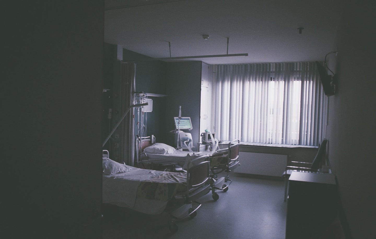 a hospital room with empty beds