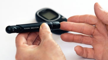 person using diabetes equipment to test their blood sugar