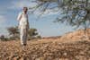 A farmer whose lands have been ravaged by locusts