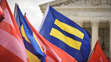 LGBTQIA+ advocates rally in front of the Supreme Court of the United States.