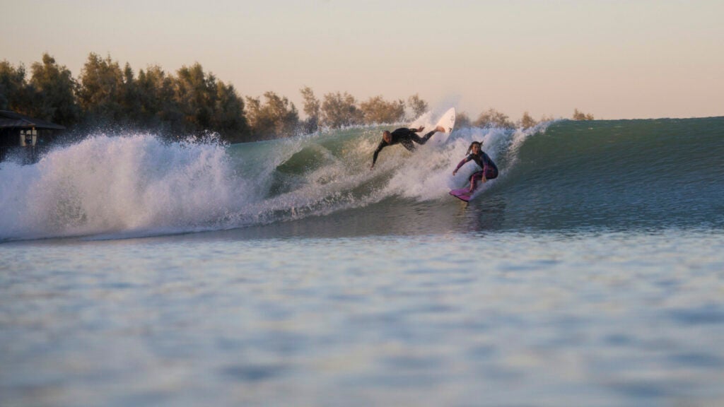 Kelly Slater and Bianca Valenti test the waves at Slater's surf park in California.