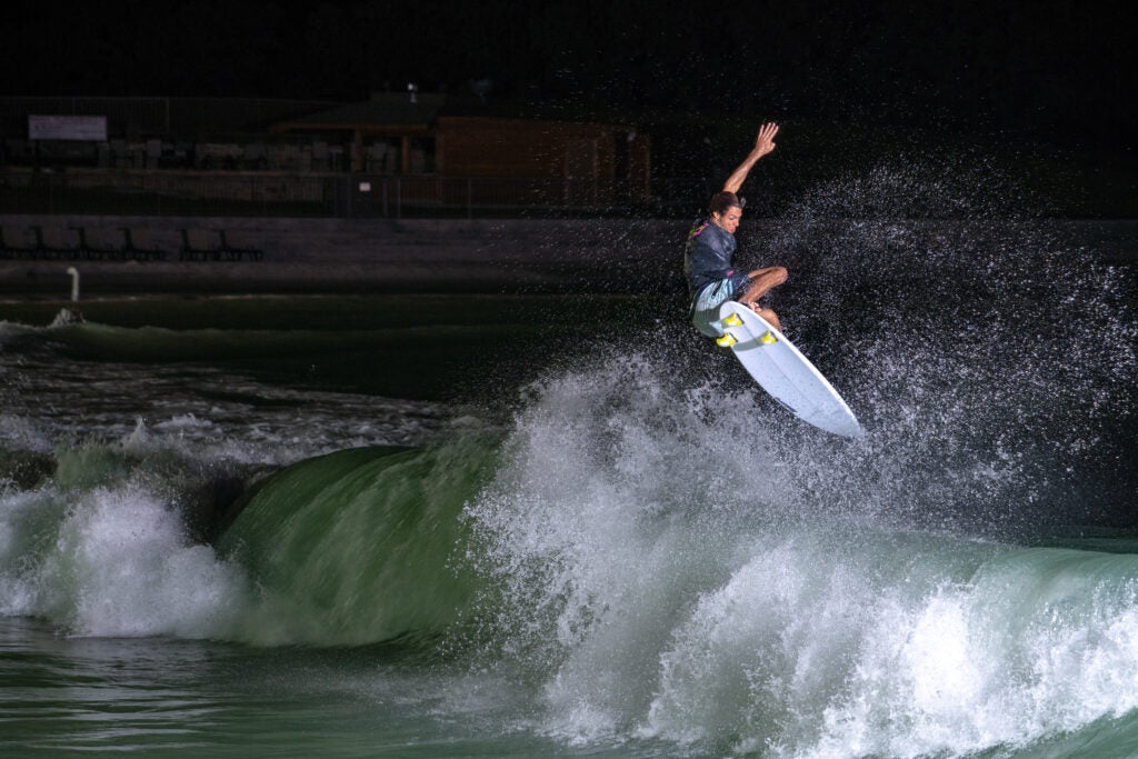 Ian Gentil crests a wave at the BSR Surf Ranch in Waco, Texas.