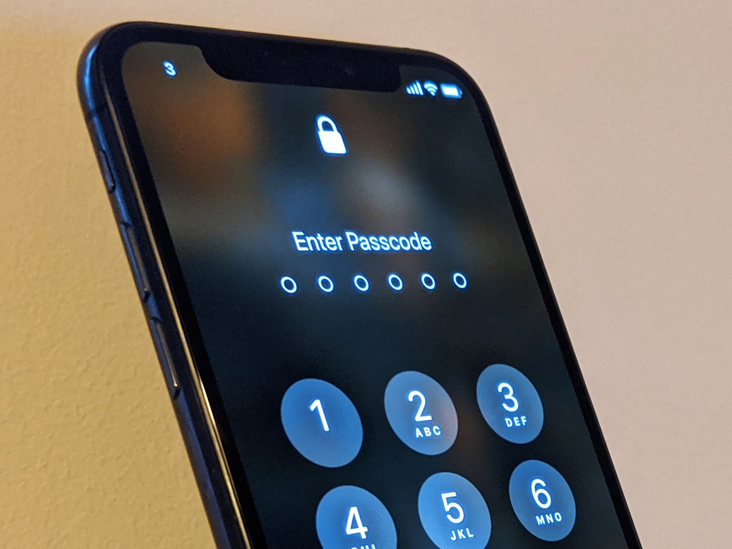 A locked iPhone displaying its lock screen.