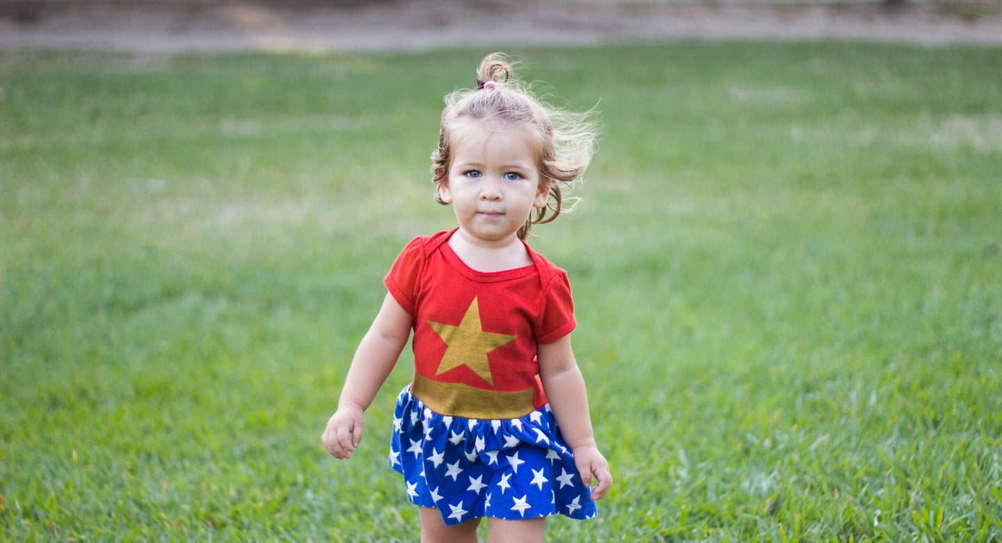 A toddler dressed as Wonder Woman