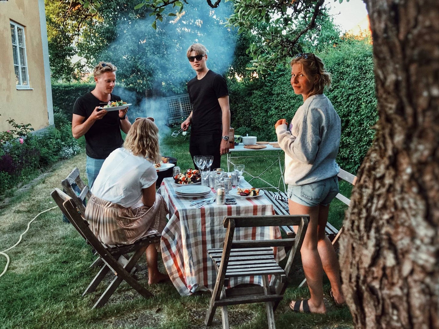 People having an outdoor barbecue