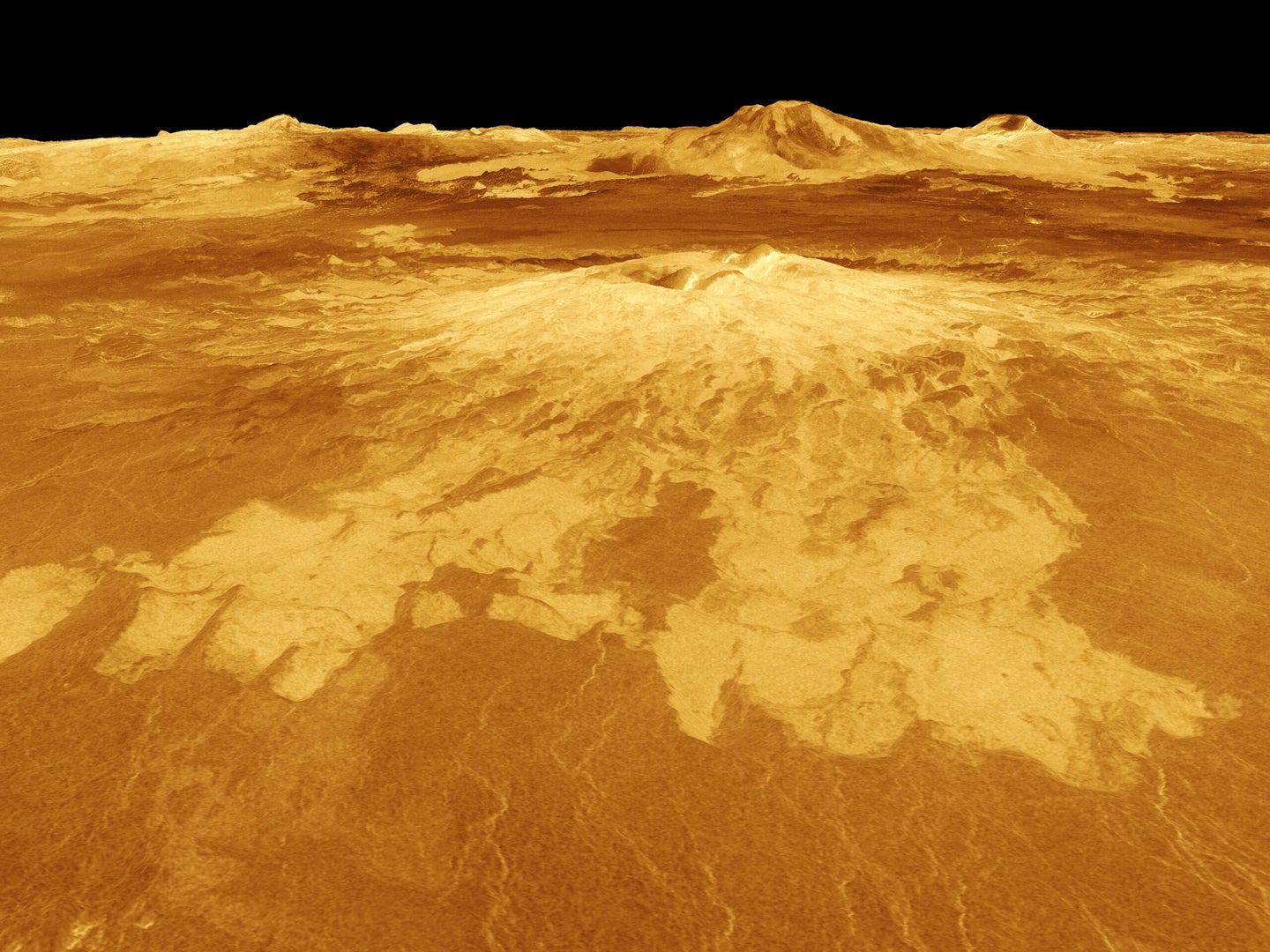 A volcano named Sapas Mons dominates this computer-generated view of the surface of Venus.