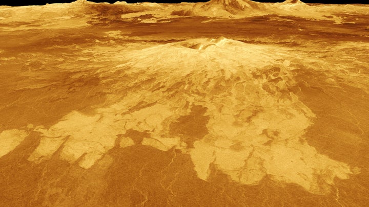 A volcano named Sapas Mons dominates this computer-generated view of the surface of Venus.