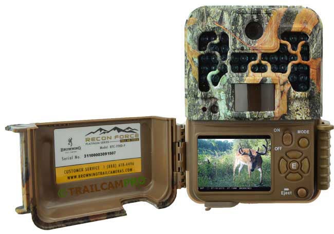 An open trail camera on a white background.