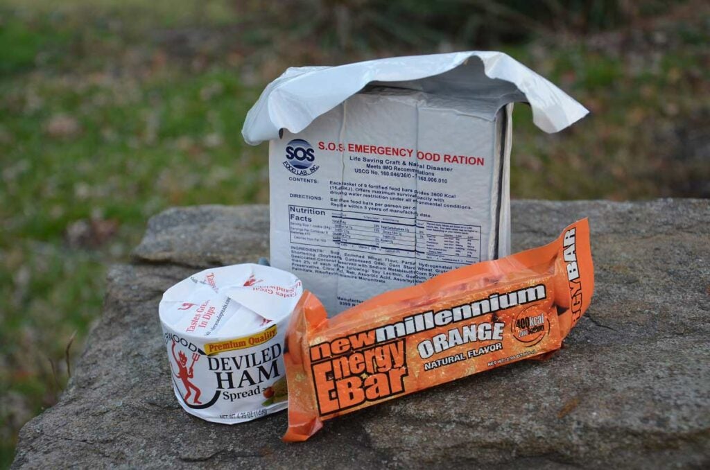 Packaged survival food on a rock.