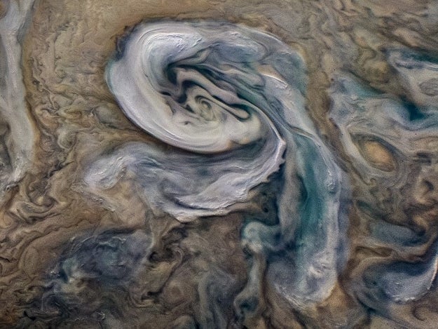 These storms are thought to contain a kind of water-ammonia hail ('mushballs') specific to Jupiter's atmosphere, which drags the ammonia down into the deep atmosphere and may explain the presence of shallow lightning flashes.