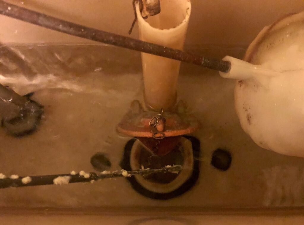 a flush valve in a toilet in use