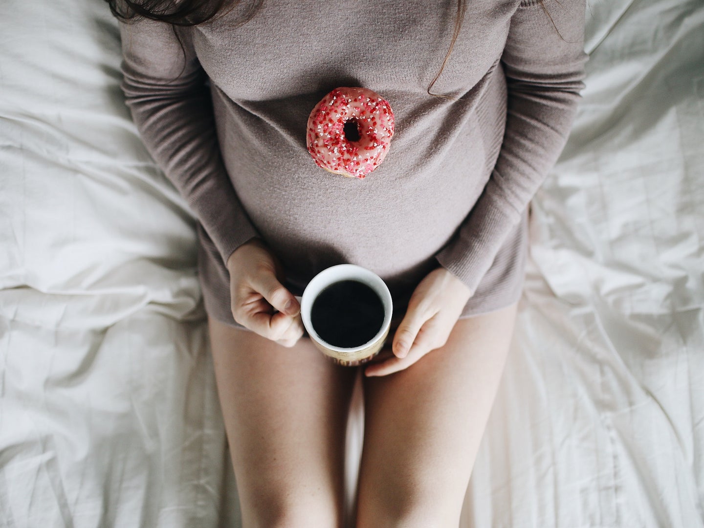 pregnant person coffee doughnut