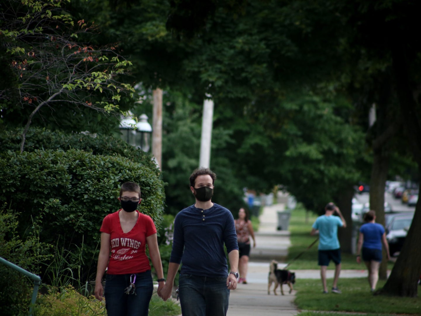 people walking around with masks in the suburbs