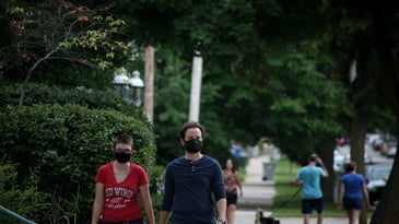 people walking around with masks in the suburbs