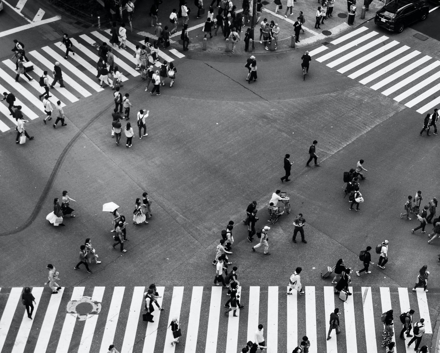 intersection in a city with people crossing