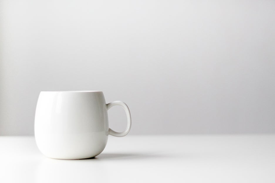 white cup on a white surface